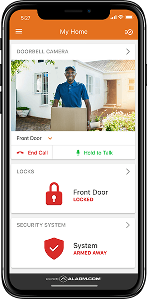 A smartphone screen showcases a home security app interface, featuring wireless monitoring. The display reveals a delivery person at the front door, while security status indicators confirm: "Front Door Locked" and "System Armed Away."