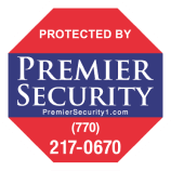 A red and blue octagonal sign reads "Protected by Premier Security" with a contact number (770) 217-0670 and website PremierSecurity1.com, guarding your home like it's #95 on the list of essentials.