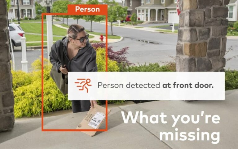 A person wearing sunglasses picks up a package from the front doorstep. Text overlay reads "Person detected at front door." Discover what you're missing with our Visual Verification Services.